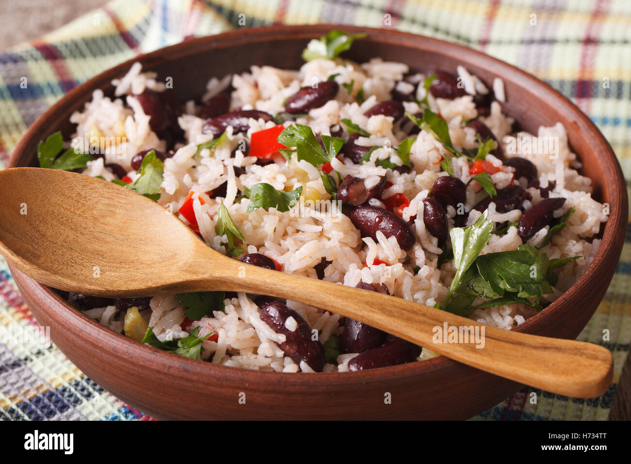 Gallo Pinto rice with red beans in a bowl closeup on the table