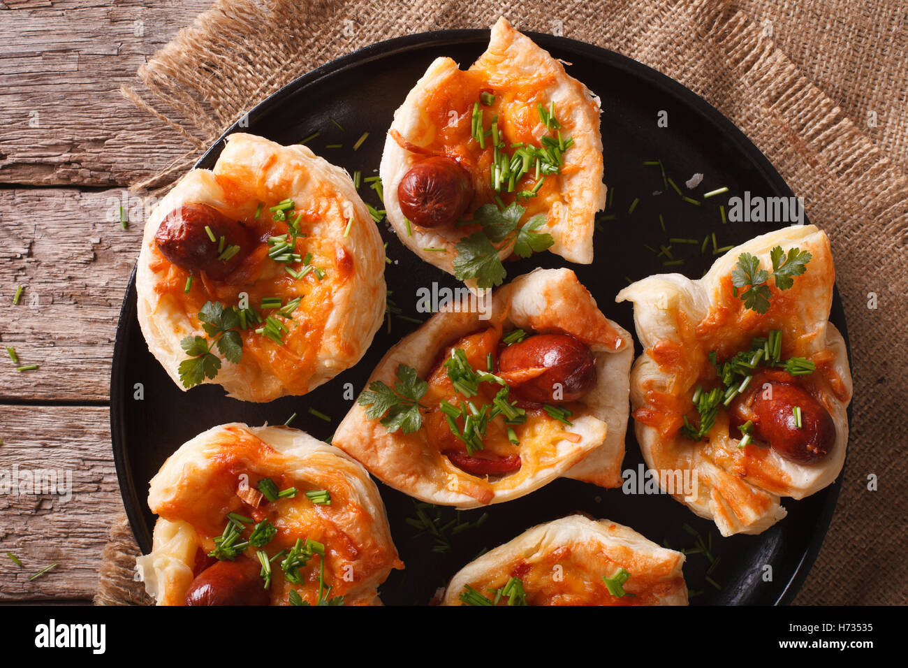 muffins stuffed with sausage and cheese on a plate close-up. horizontal view from above Stock Photo