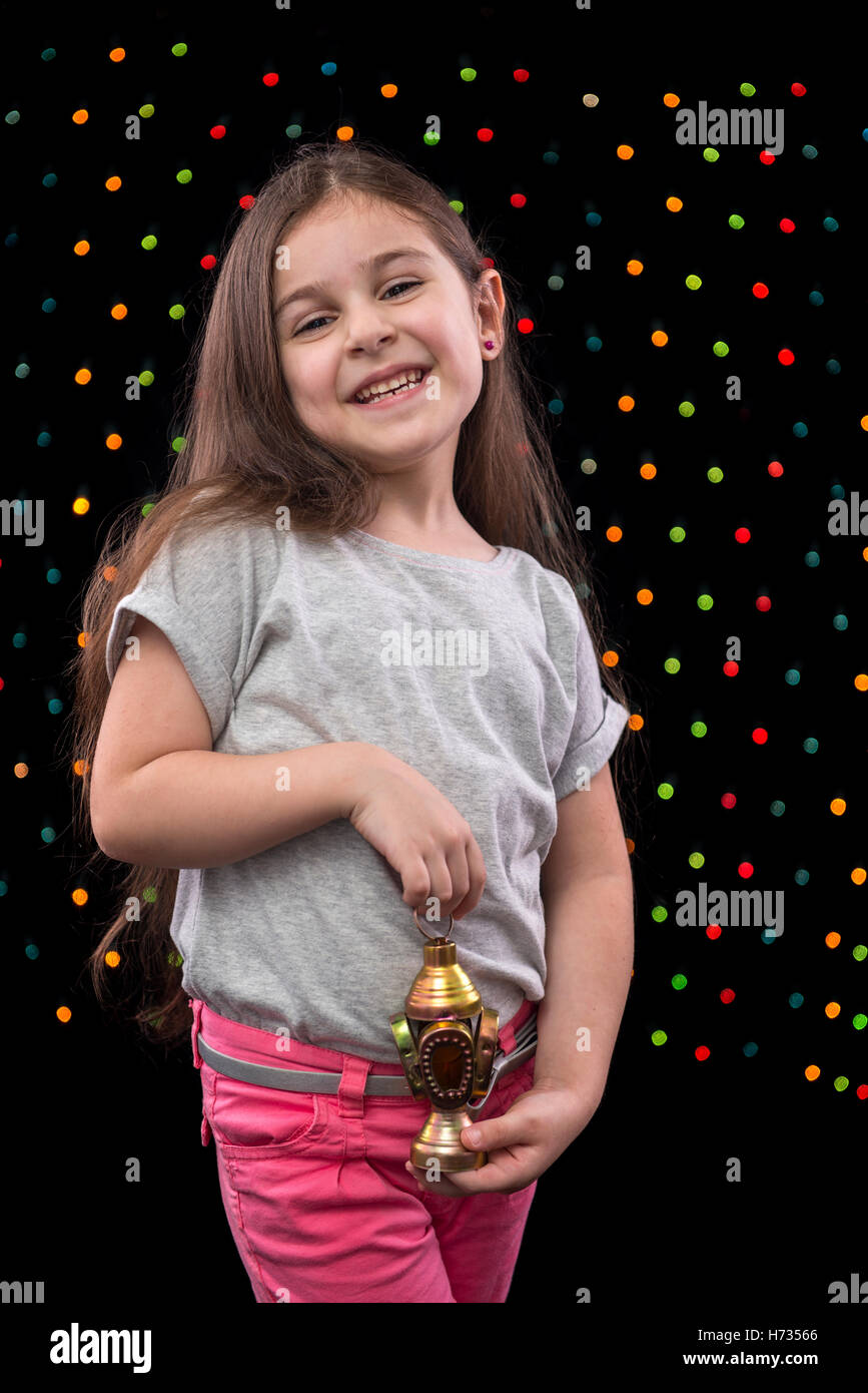 Sweet Happy Girl Celebrating with Ramadan Lantern Stock Photo