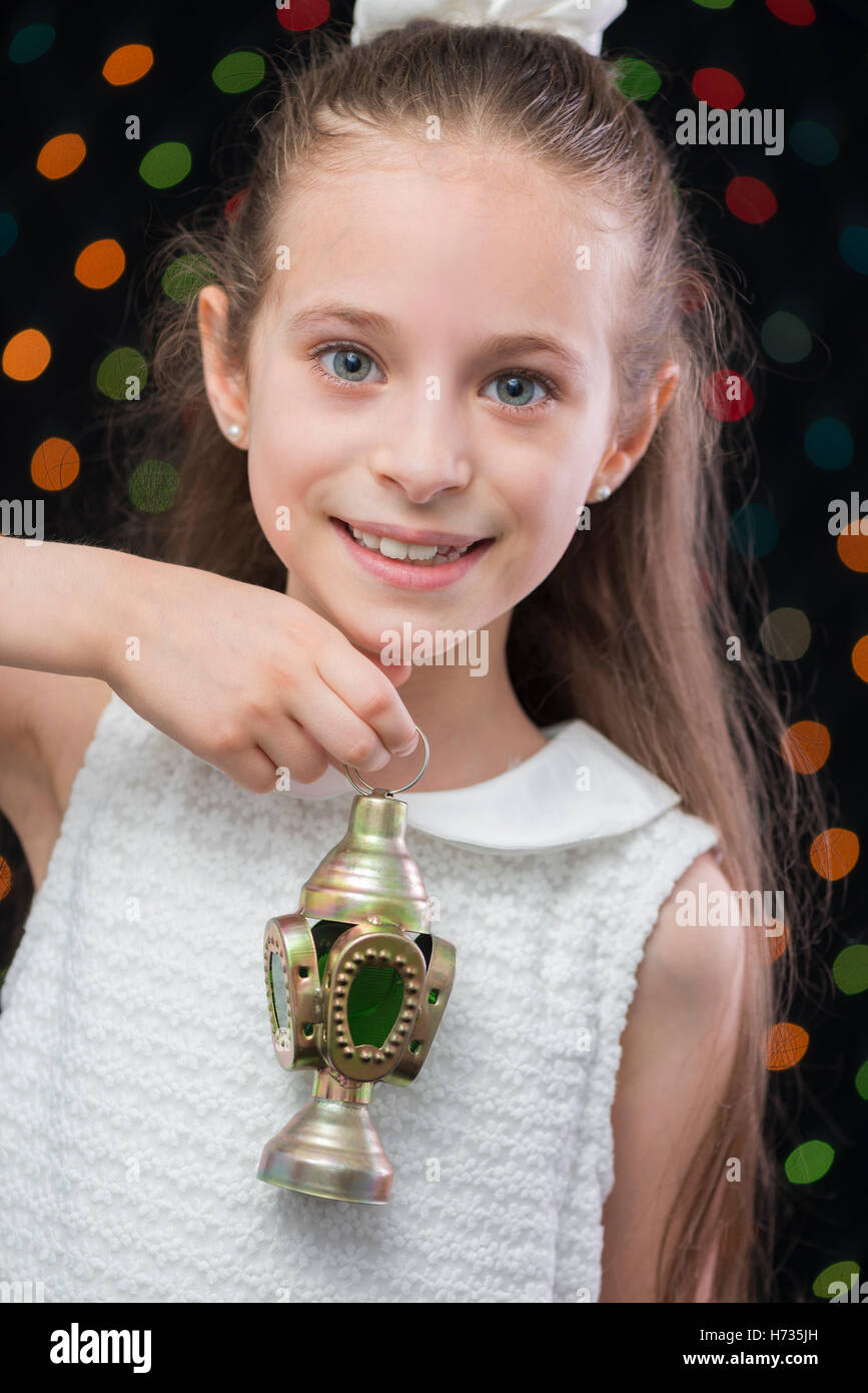 Smiling Girl Celebrating with Ramadan Lantern Stock Photo