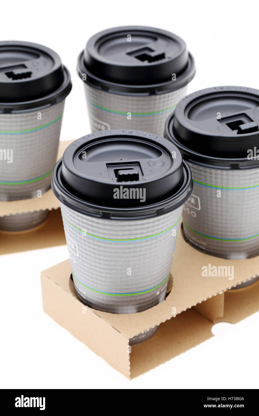 Paper cups of coffee in holder, isolated on white background Stock ...