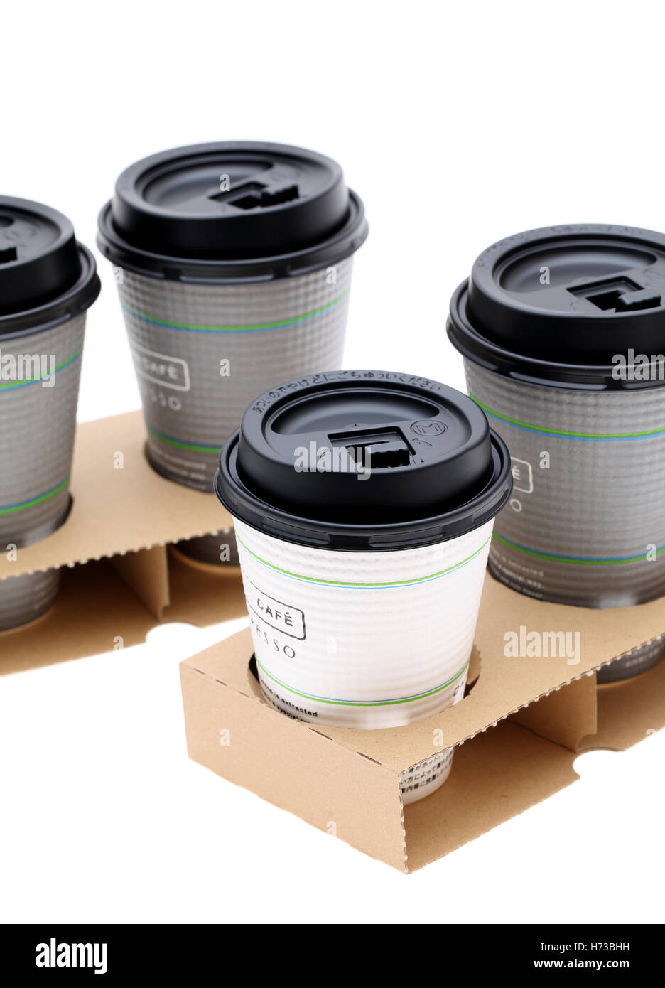 Paper cups of coffee in holder, isolated on white background Stock ...