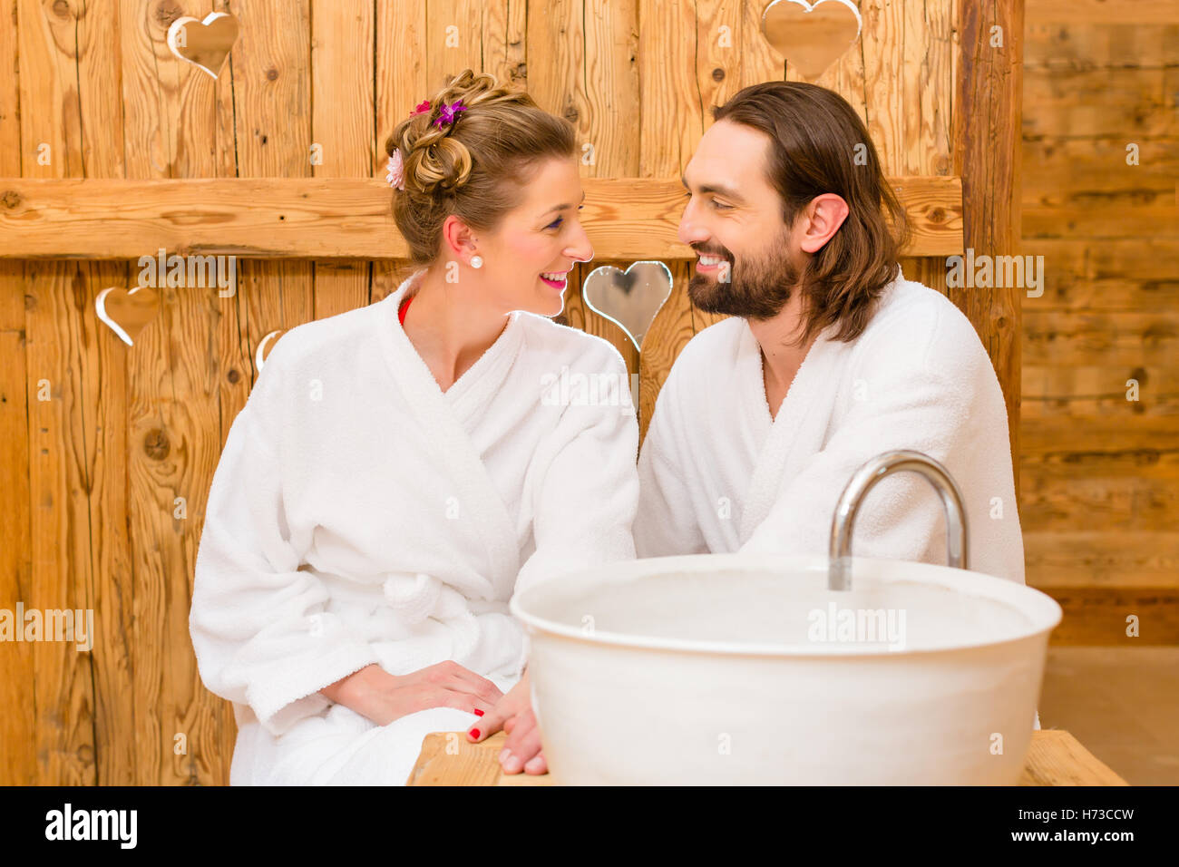 woman relaxation wood romantic european caucasian hotel outing bathrobe refreshing weekend wash basin valentines day luxury Stock Photo
