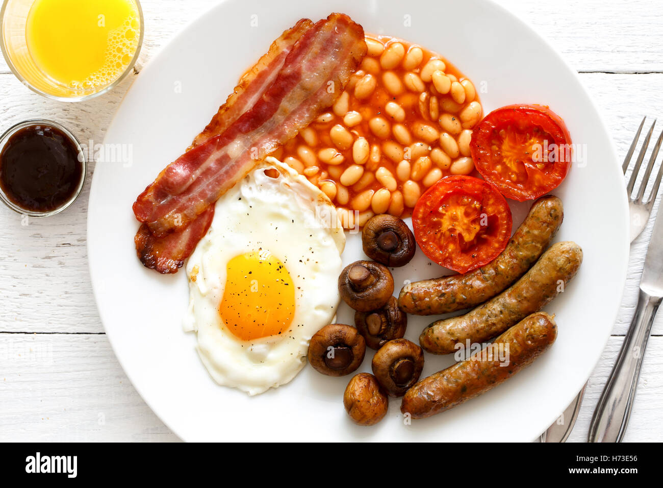 Plate of traditional fried English breakfast with orange juice from above  Stock Photo - Alamy