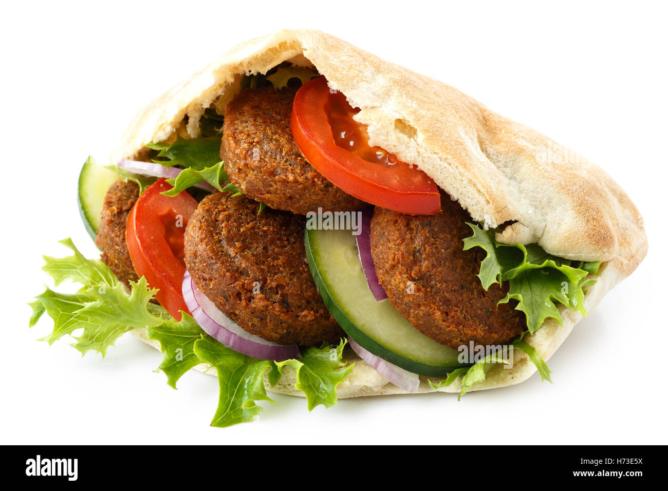 Pita bread filled with falafel and salad isolated on white. Stock Photo