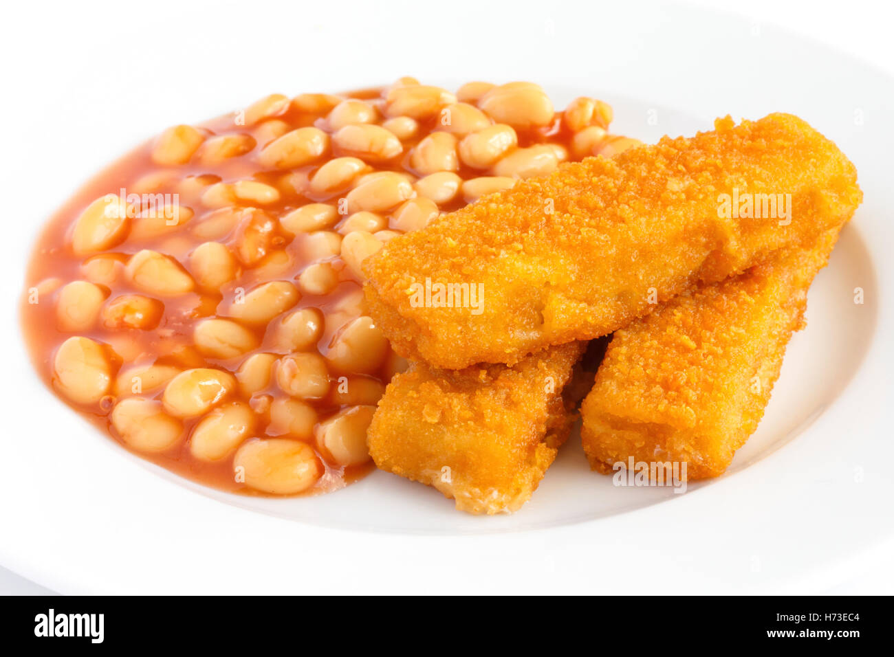 Plate of baked beans with fried fishfingers Stock Photo Alamy
