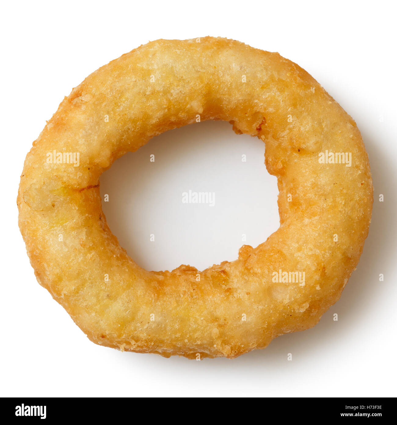 Single deep fried onion or calamari ring isolated from above. Stock Photo