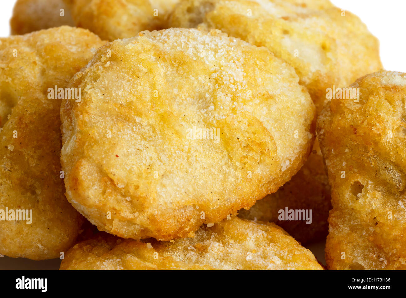 Detail of frozen battered chicken nuggets uncooked. Stock Photo