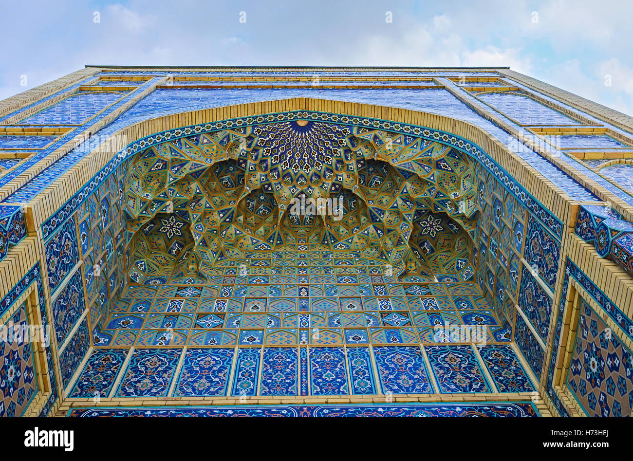 The central portal of Islamic University decorated with colorful glazed tiles and carved details ...