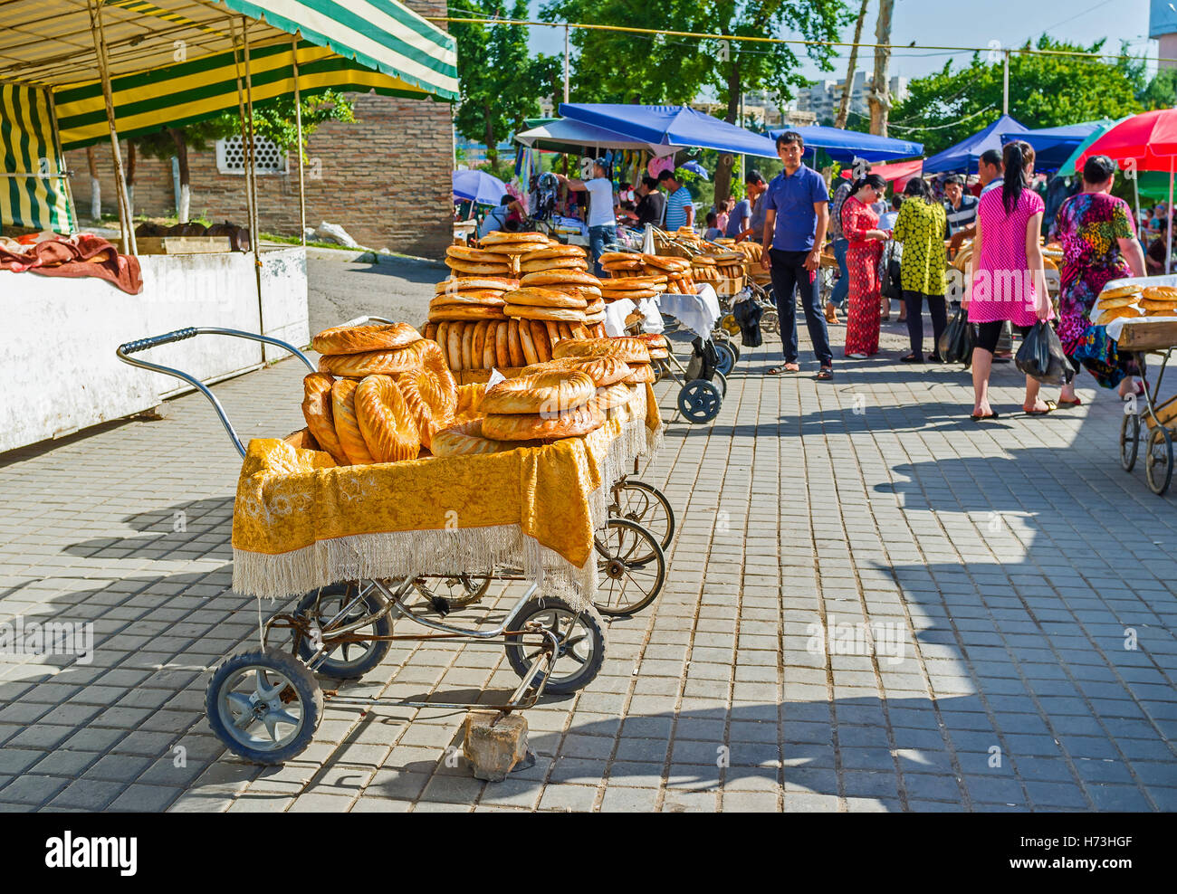 The small carts full of lochira - the traditional Uzbek flat bread in Chorsu Bazaar Stock Photo