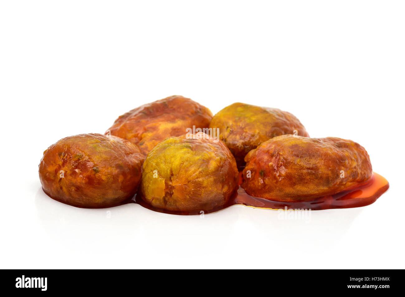 some peeled prickly pear fruits in their own juice, on a white background Stock Photo