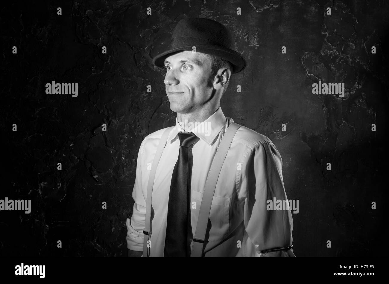 Black and white picture of handsome private detective. Agent stay front