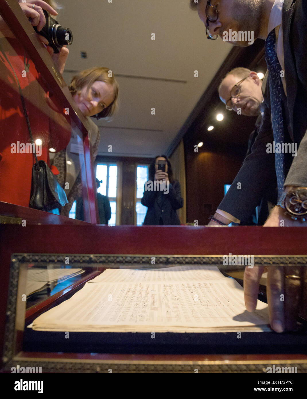 Hamburg, Germany. 2nd Nov, 2016. Lukas Baumann (R), expert for musical handwriting at the auction house Sotheby's goes through the original score of the 'Resurrection Symphony' by Gustav Mahler (1860-1911) at a press visitation in Hamburg, Germany, 2 November 2016. The manuscript will be auctioned at Sotheby's in London. The estimated price lies at 3, 5 Million pounds (3, 87 Million Euros). Photo: Christian Charisius/dpa/Alamy Live News Stock Photo