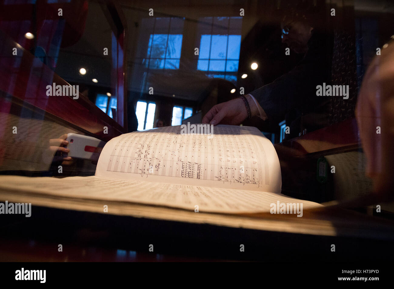 Hamburg, Germany. 2nd Nov, 2016. Simon Maguire, expert for musical handwriting at the auction house Sotheby's goes through the original score of the 'Resurrection Symphony' by Gustav Mahler (1860-1911) at a press visitation in Hamburg, Germany, 2 November 2016. The manuscript will be auctioned at Sotheby's in London. The estimated price lies at 3, 5 Million pounds (3, 87 Million Euros). Photo: Christian Charisius/dpa/Alamy Live News Stock Photo