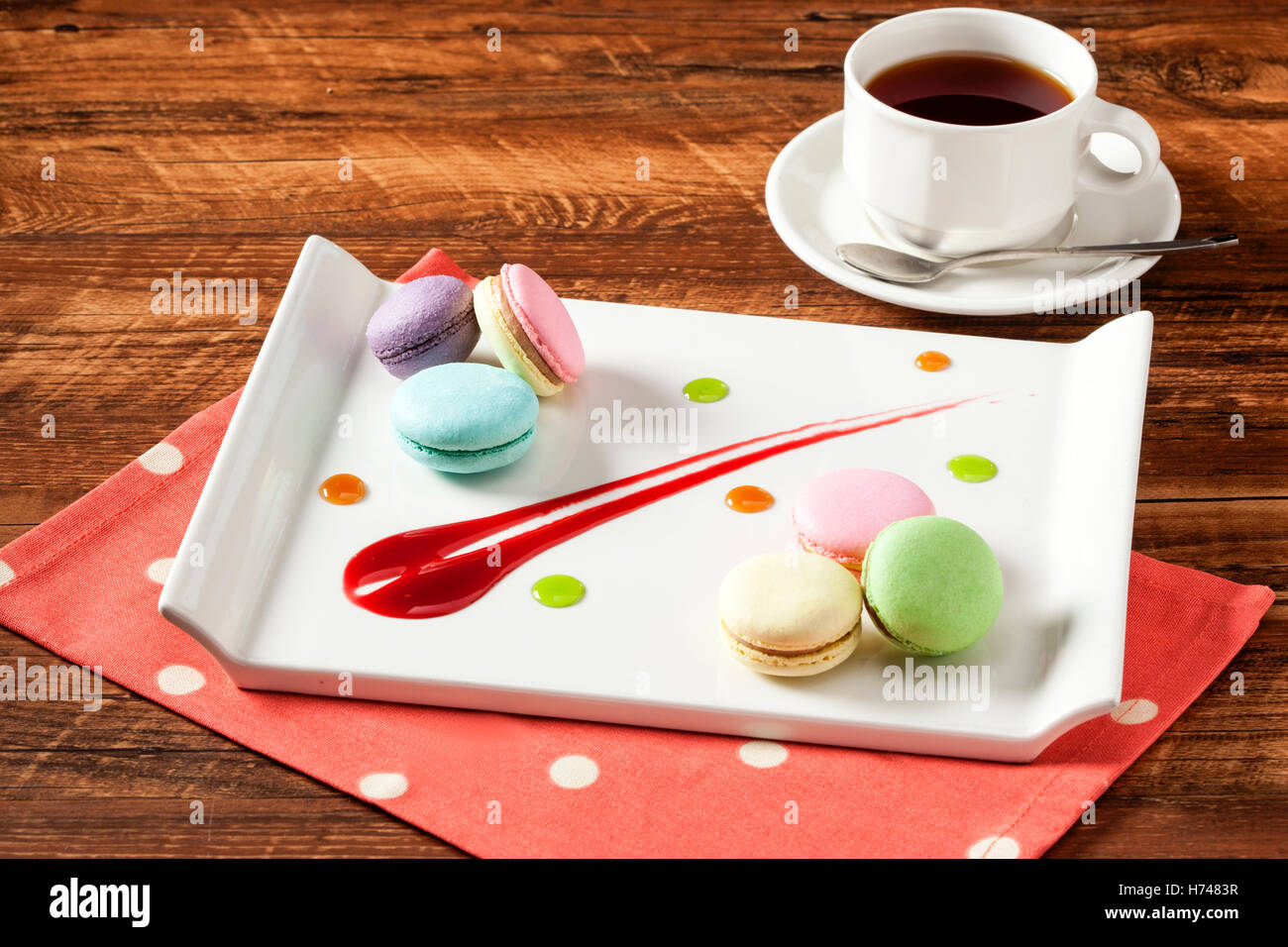 Colorful macaroon with black coffee on wooden table Stock Photo