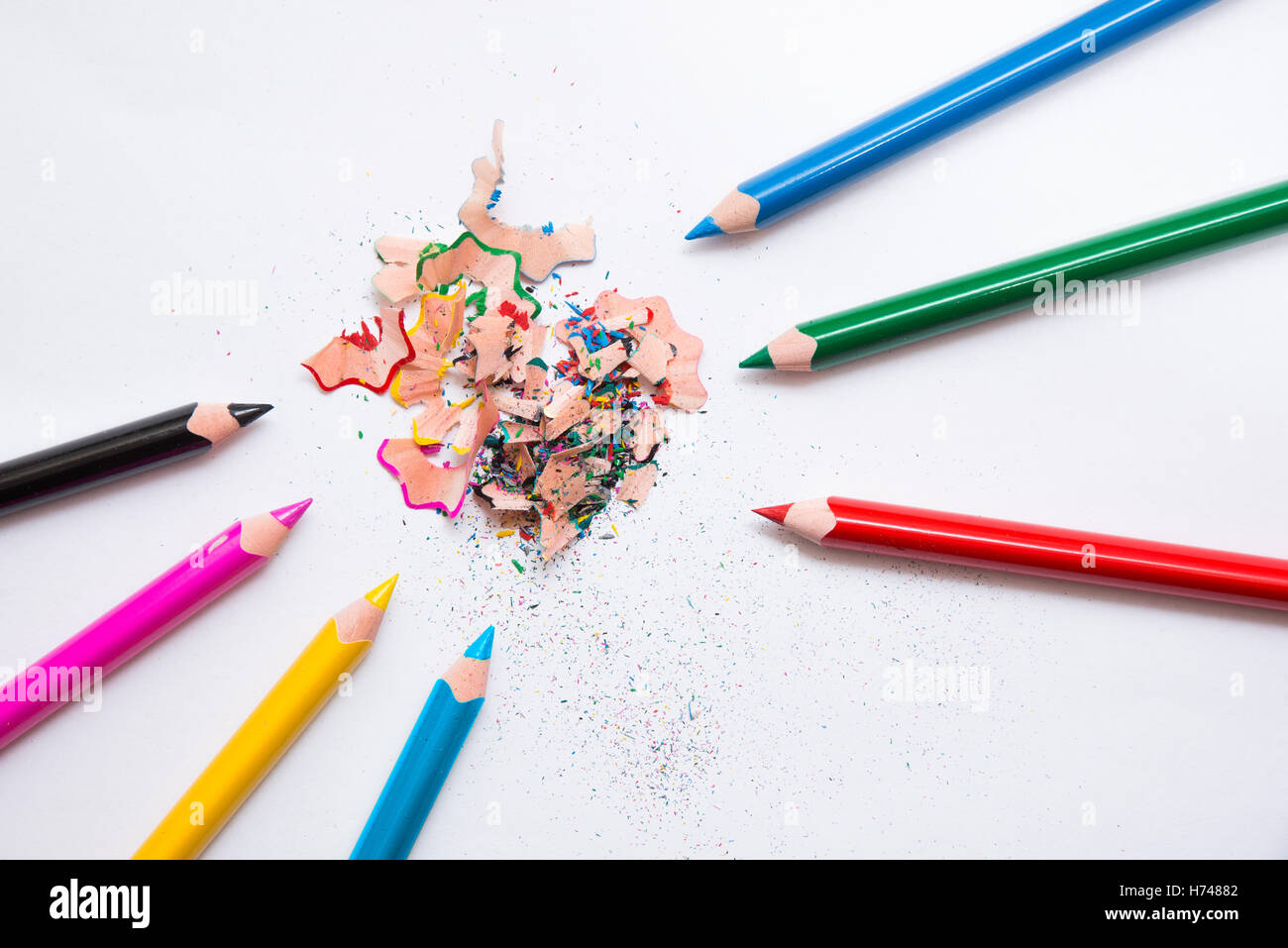 7 crayons and sharpener's peeling. Primary colors, RGB, CMYK Stock Photo