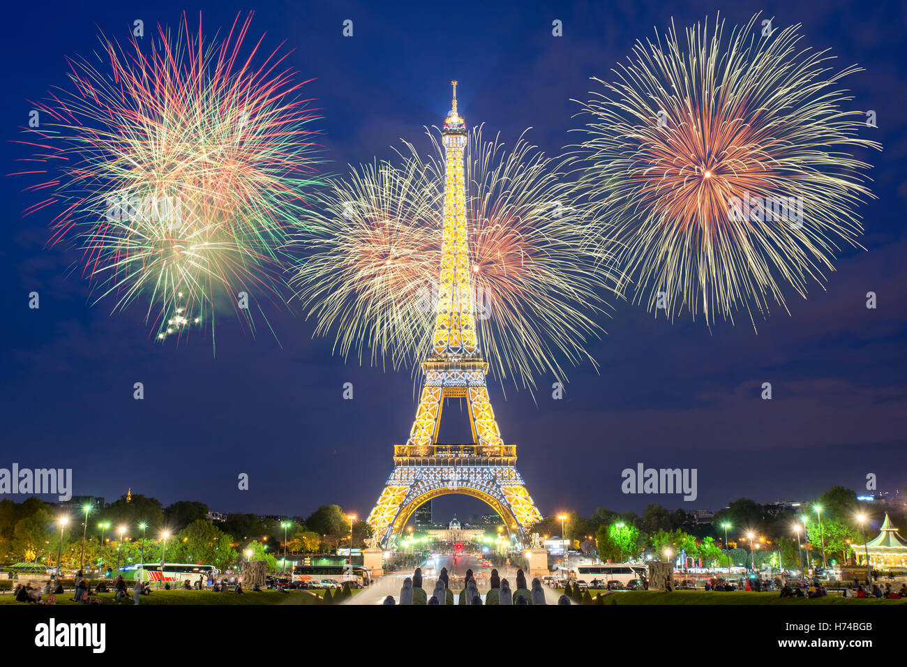 Eiffel tower light performance show and New Year 2017 fireworks in night. Stock Photo