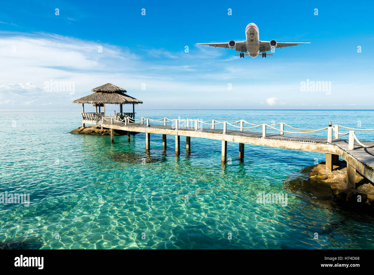 Airplane is arriving tropical resort in the morning at Phuket, Thailand. Travel, Summer, Vacation and Holiday concept. Stock Photo