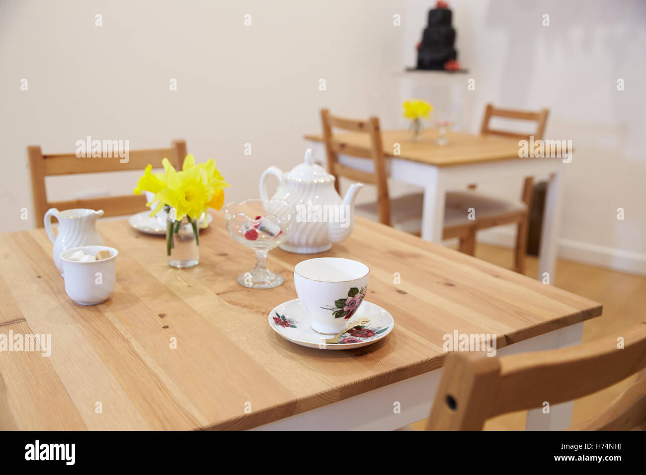 Interior Of Empty Tea Shop With Tables And Crockery Stock Photo