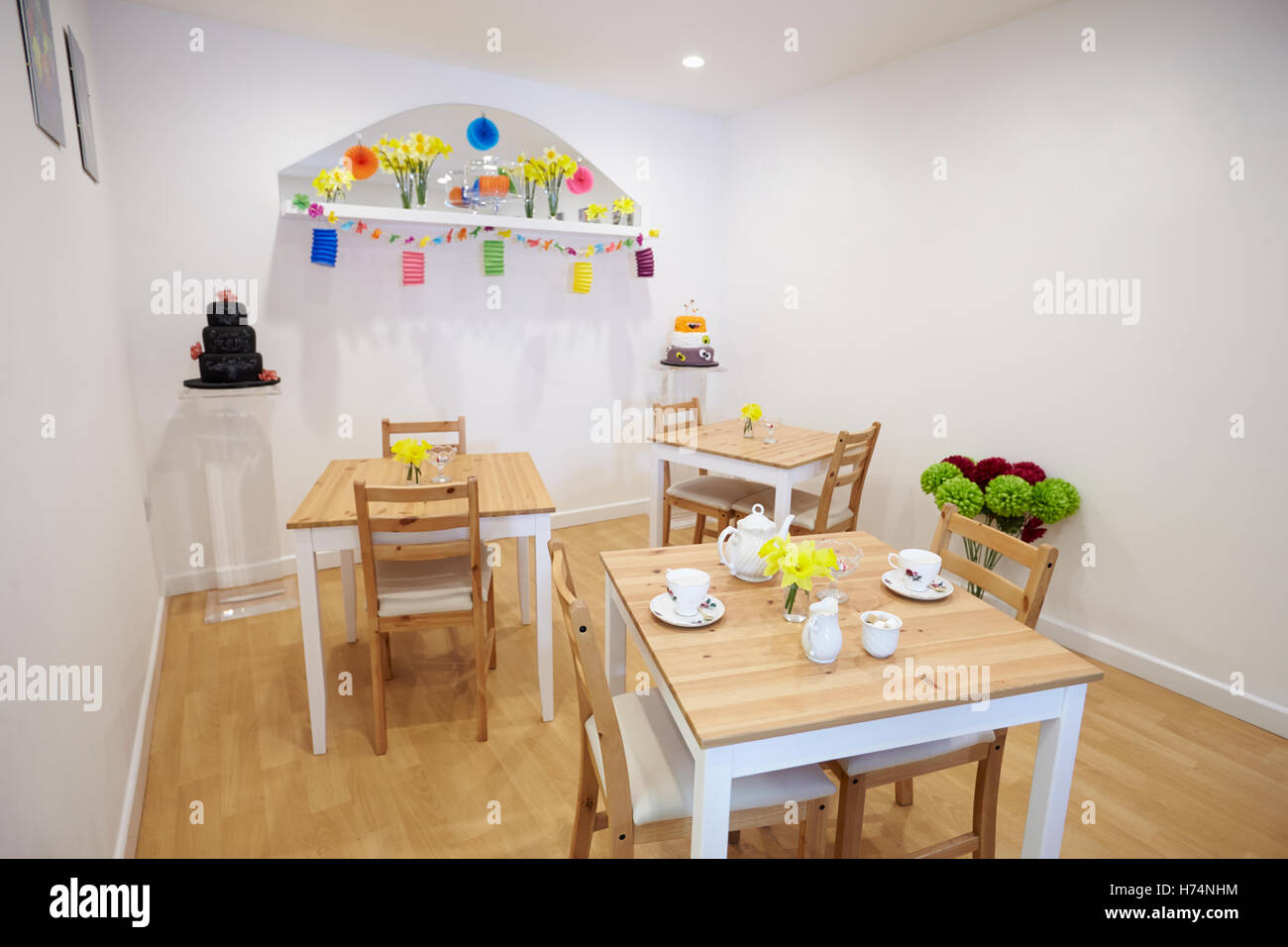 Interior Of Empty Tea Shop With Tables And Crockery Stock Photo