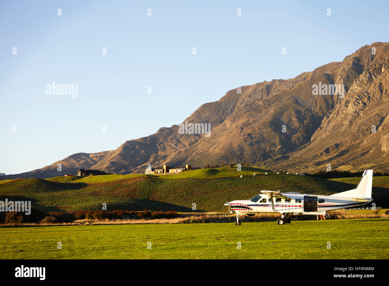 Light Aircraft Used For Skydiving In New Zealand Field Stock Photo