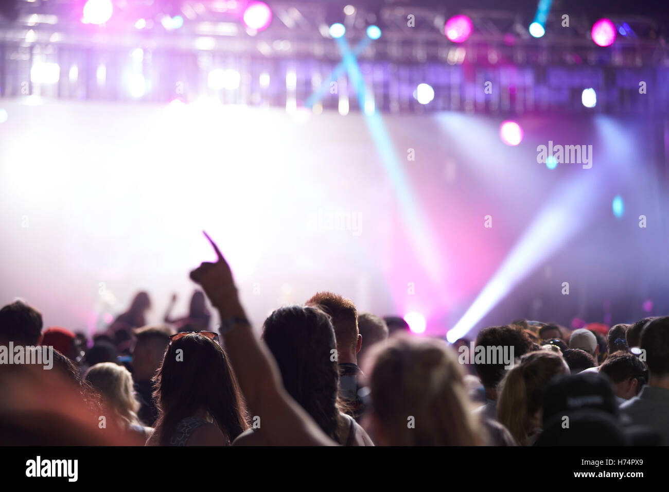Rear View Of Audience Enjoying Music Festival Stock Photo