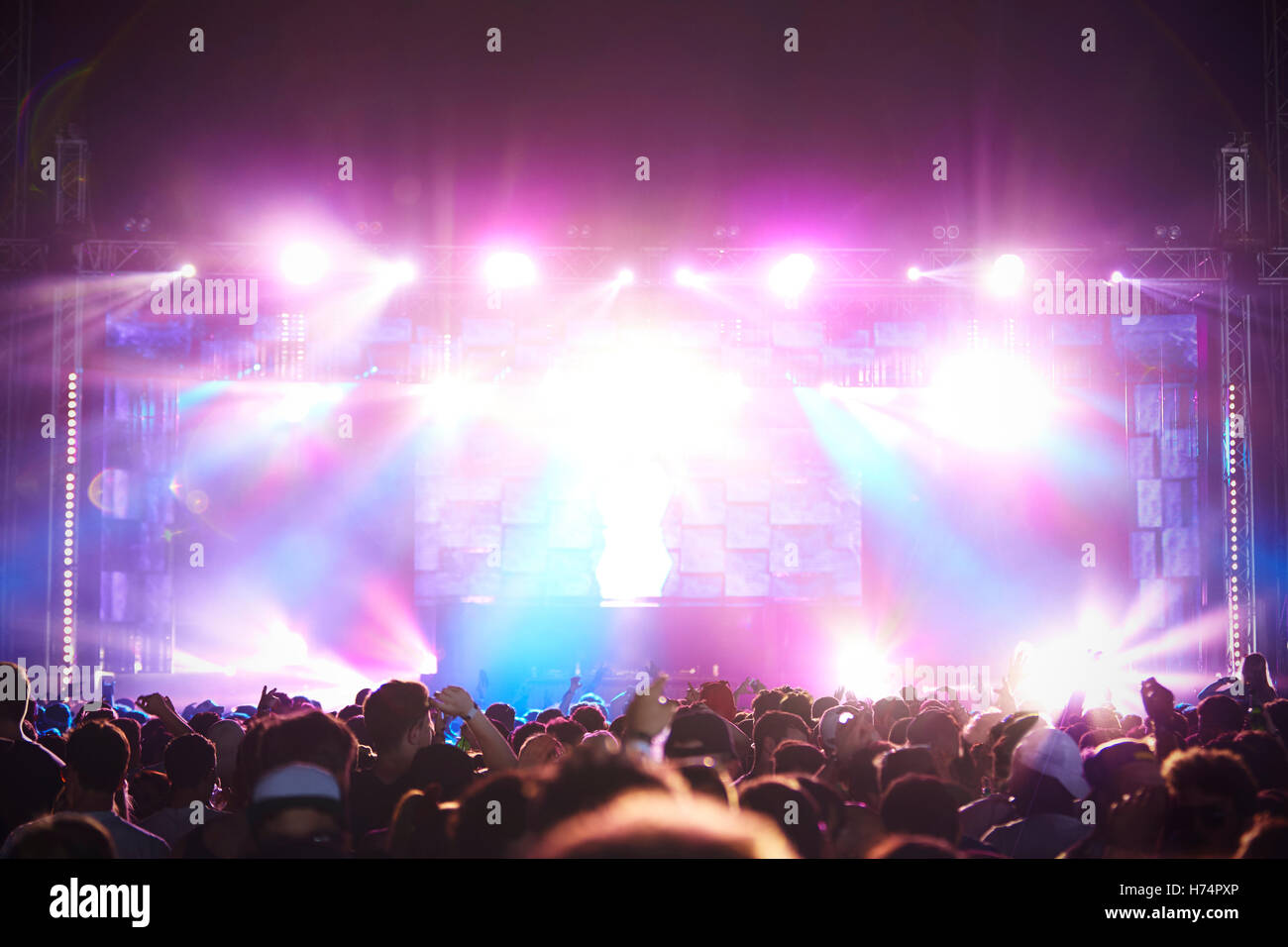 Rear View Of Audience Enjoying Music Festival Stock Photo