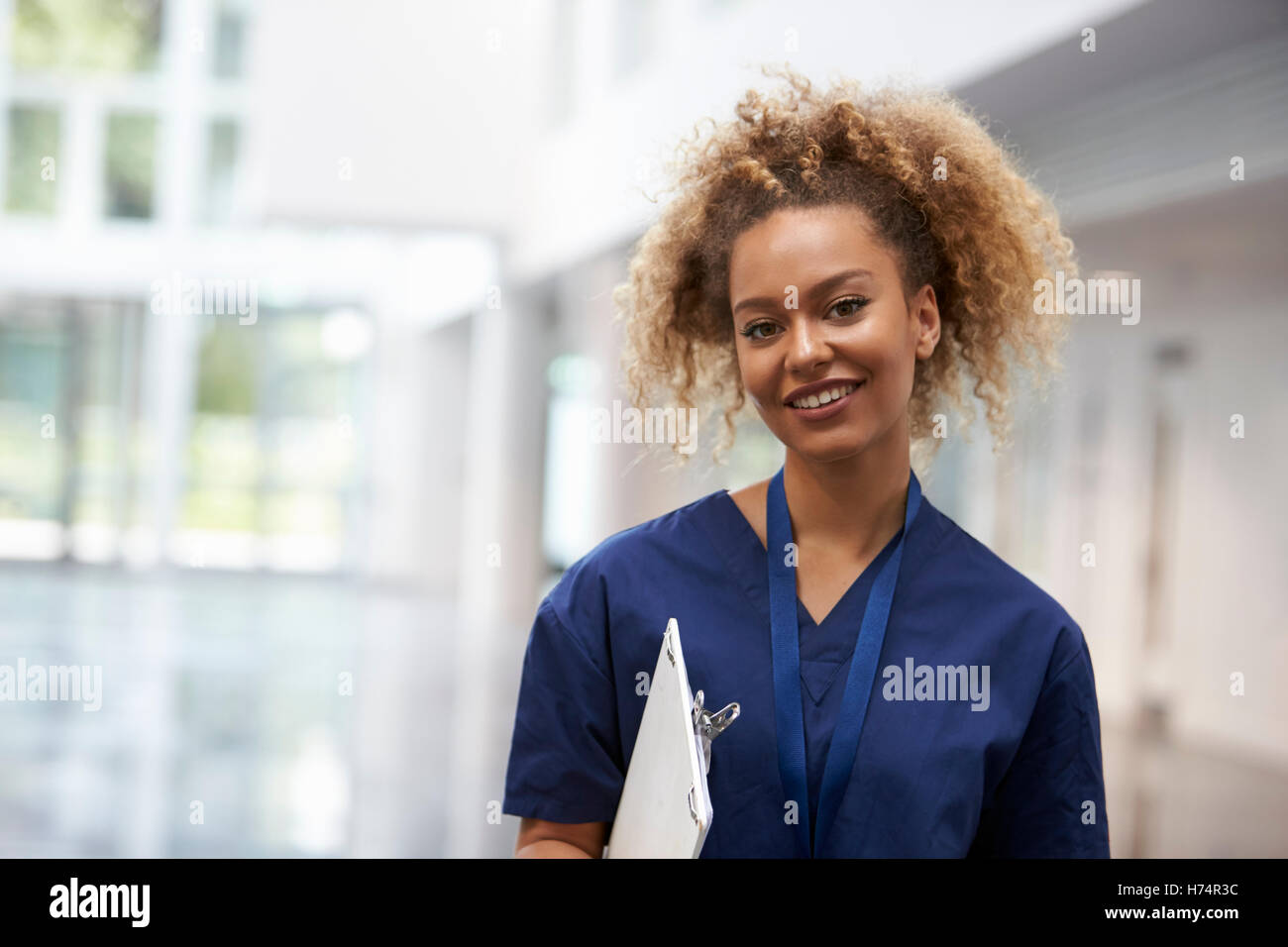 Portrait Of Female Nurse Wearing Scrubs In Hospital Stock Photo
