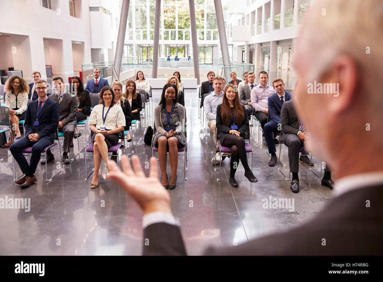 Audience Applauding Speaker After Conference Presentation Stock Photo