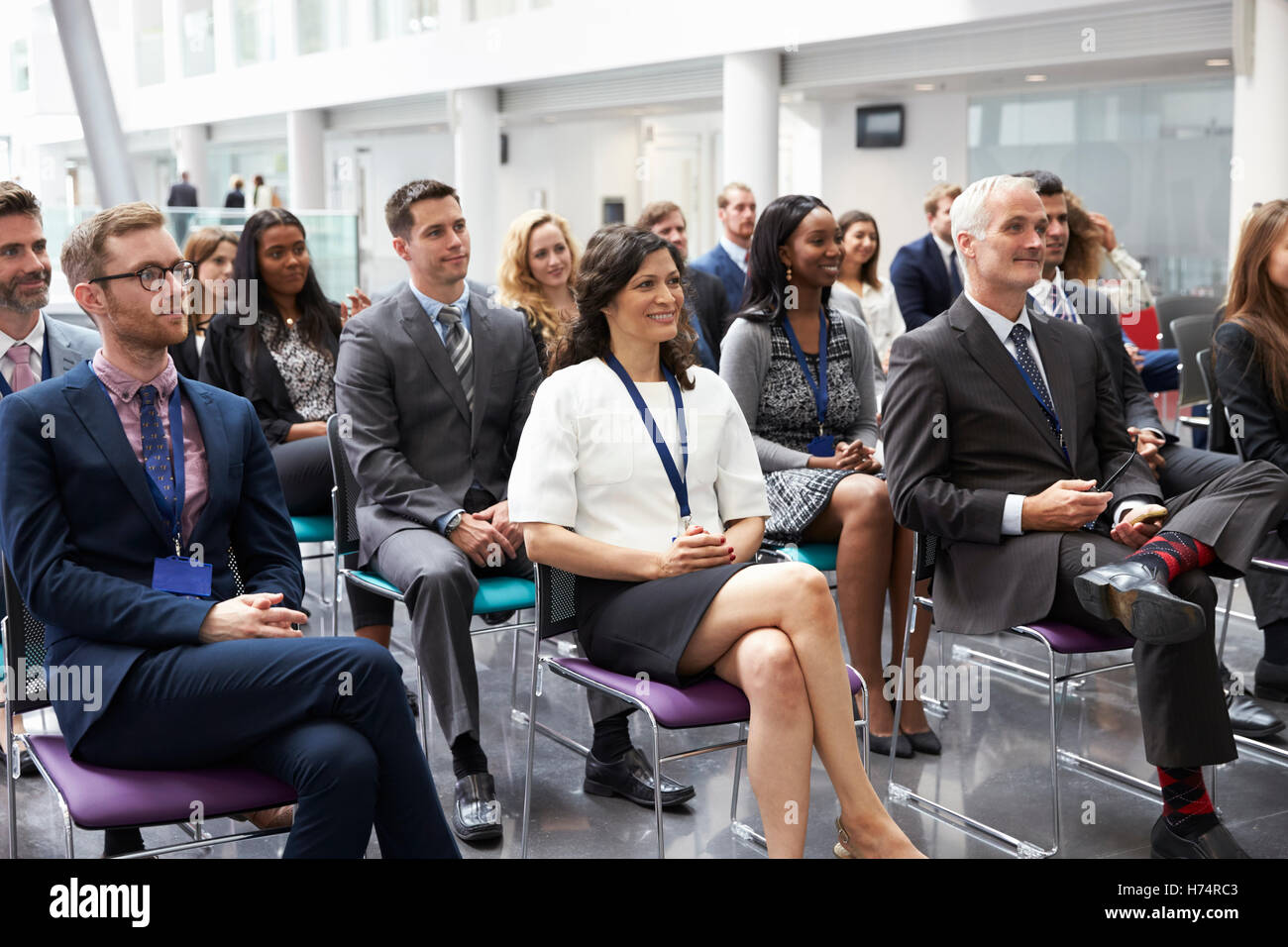 Audience Listening To Speaker At Conference Presentation Stock Photo