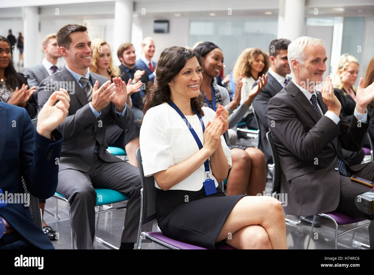 Audience Applauding Speaker After Conference Presentation Stock Photo