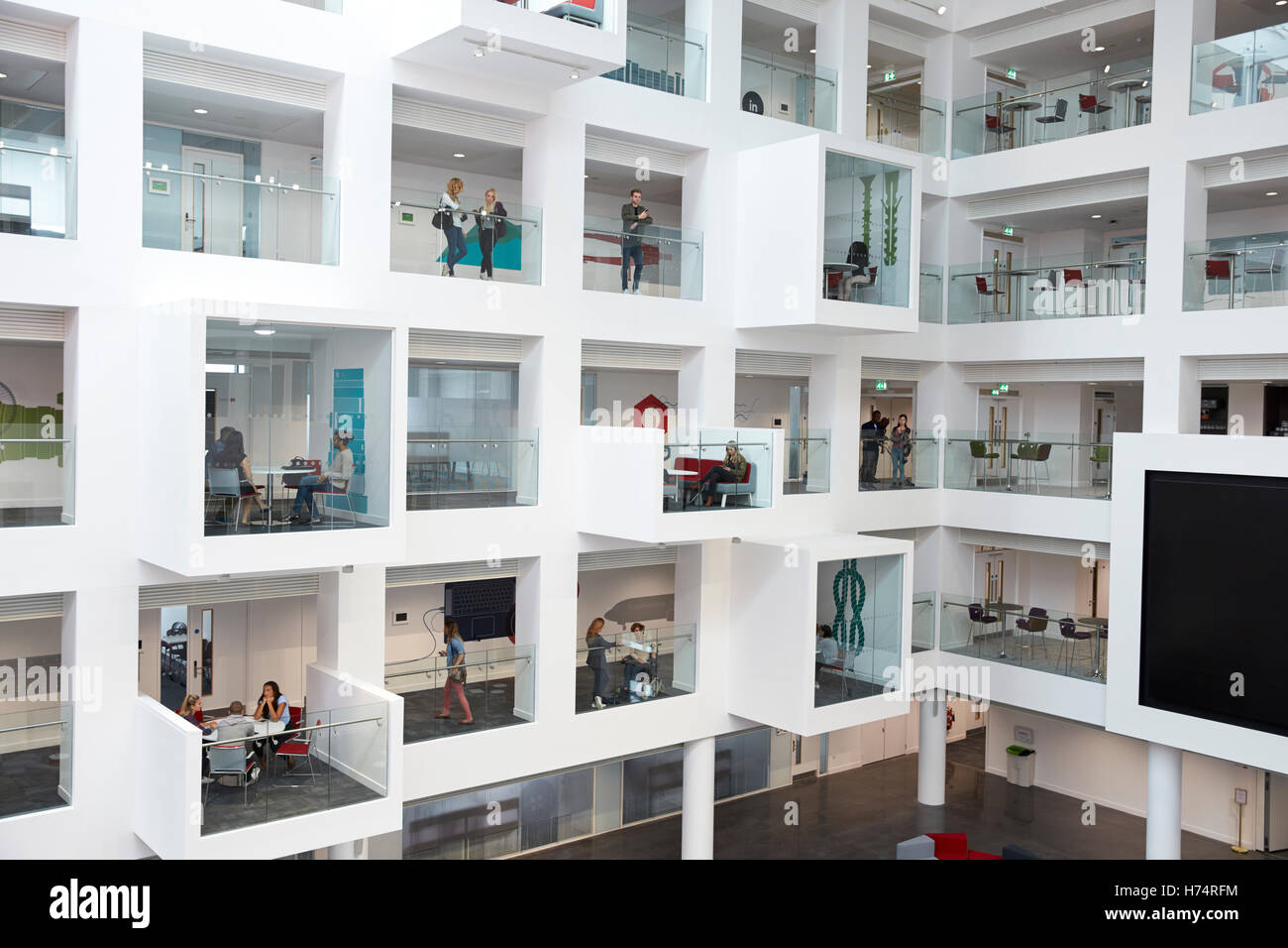 Wide view of students in study cubicles in modern university Stock Photo