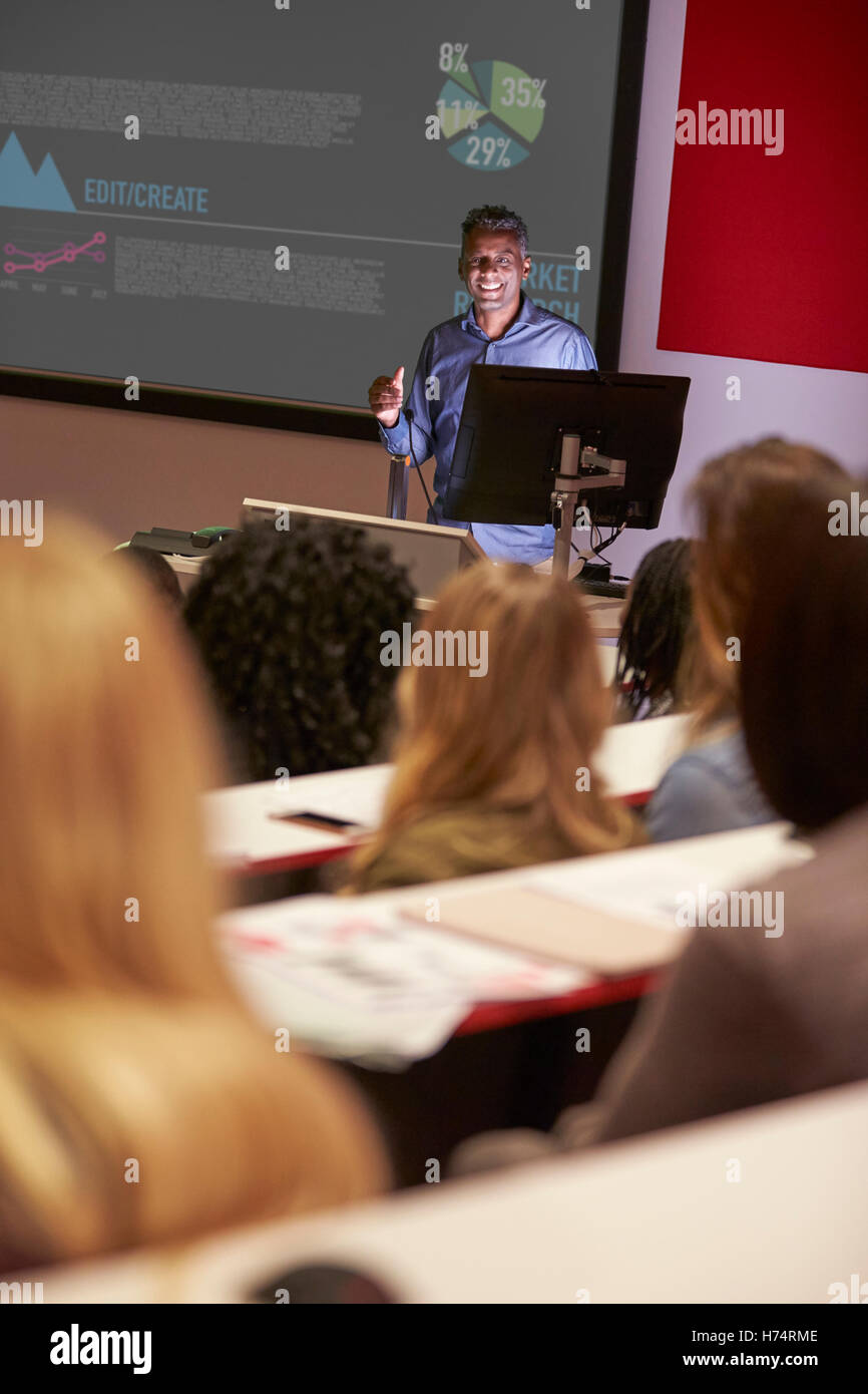 Lecture in a darkened university lecture theatre, vertical Stock Photo