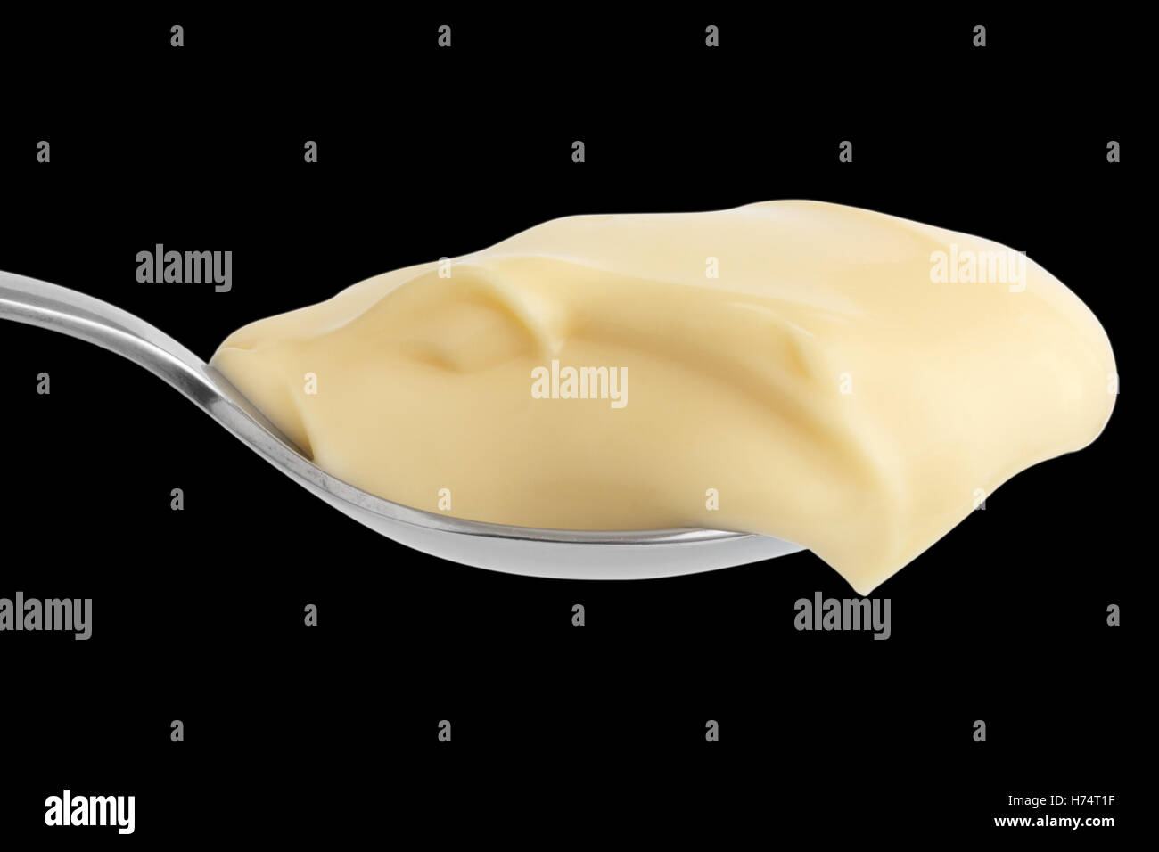 Detail of mayonnaise on stainless steel spoon. Isolated Stock Photo Alamy