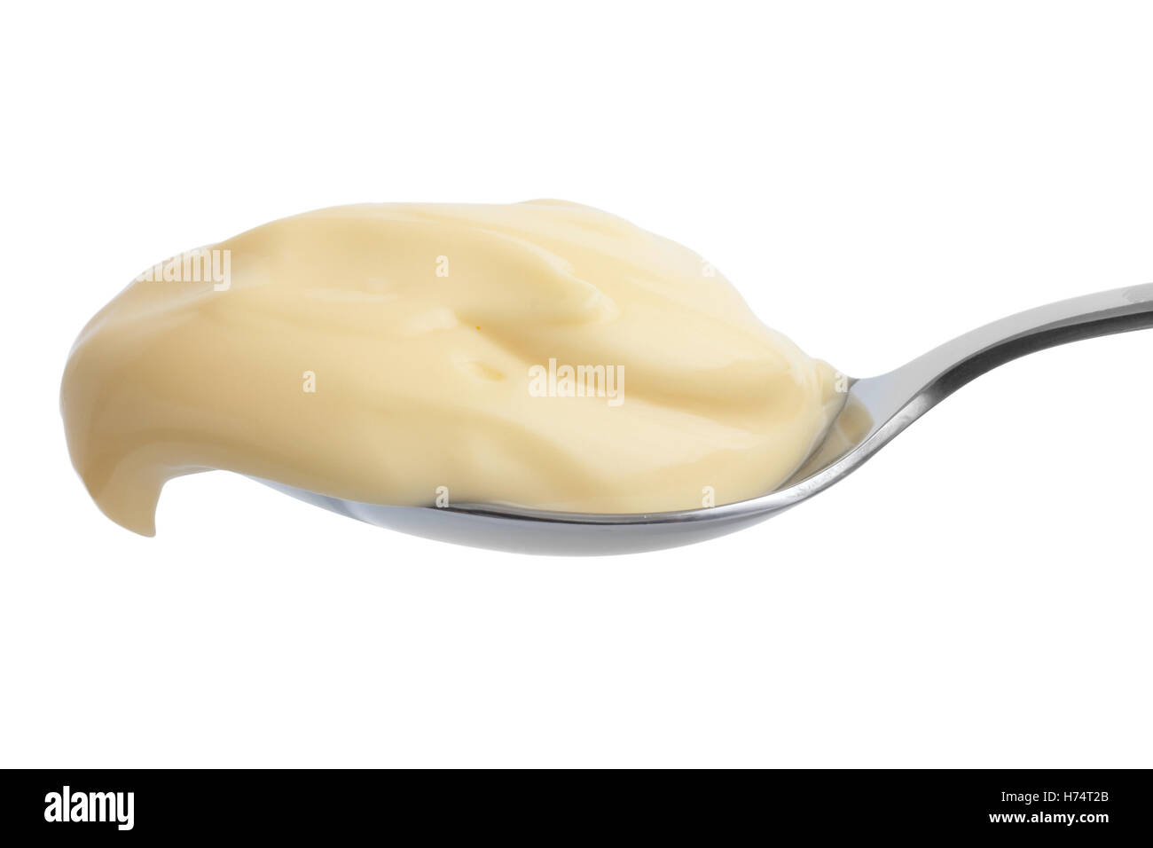 Detail of mayonnaise on stainless steel spoon. Isolated Stock Photo Alamy