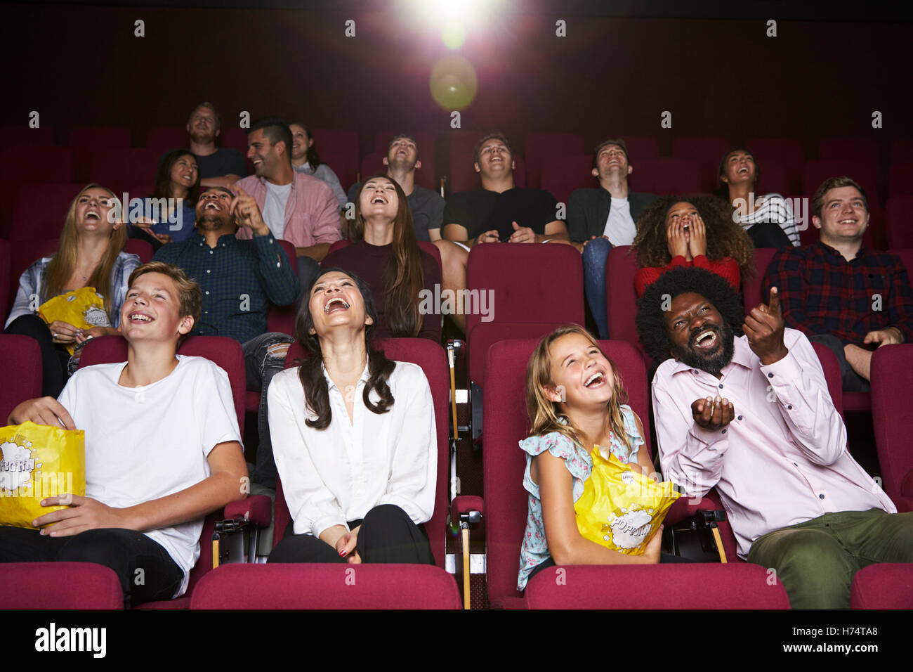 Audience In Cinema Watching Comedy Film Stock Photo