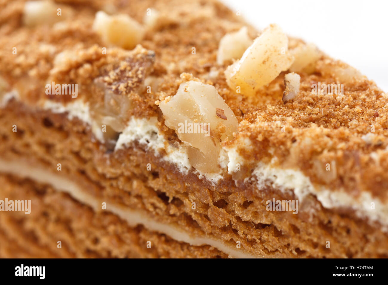 Slice of layered honey cake. Stock Photo