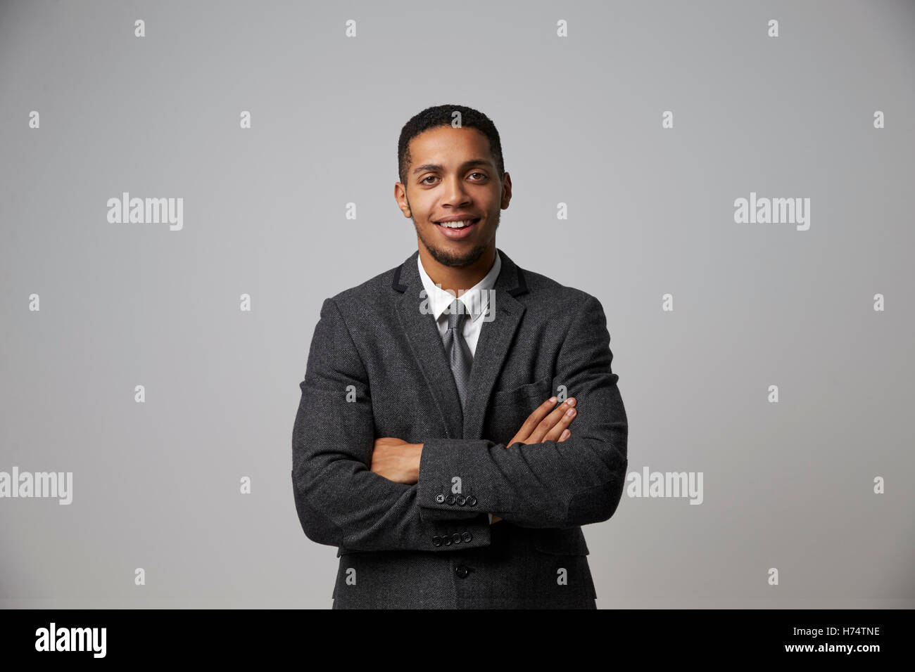 Studio Portrait Of Businessman Wearing Suit Stock Photo