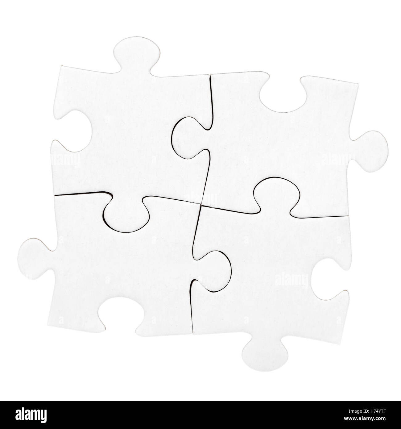 Four cardboard jigsaw puzzle pieces isolated on white Stock Photo Alamy