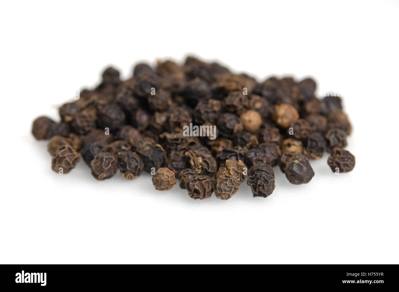 Black pepper (also named as piper nigrum, Piperaceae pepper, peppercorn, or simply black pepper) isolated on white background Stock Photo