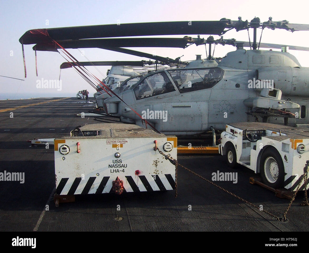 27th January 2003  Flight Deck Tractors and Super Cobra helicopters on the flight deck of the USS Nassau in the Persian Gulf. Stock Photo