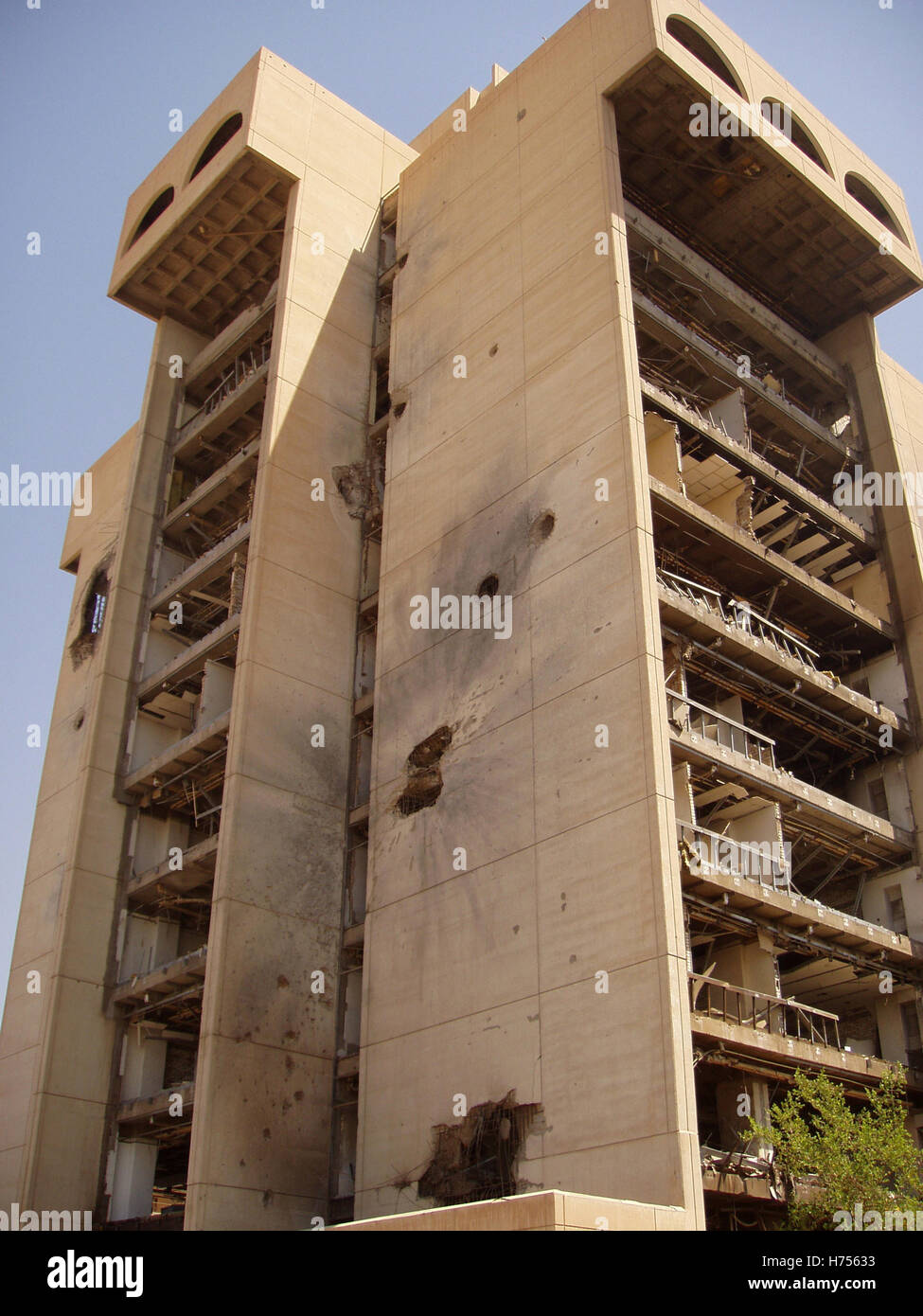 24th July 2003 Shell-damaged apartment building at the Al Jumhuriya Bridge in Baghdad, Iraq. Stock Photo