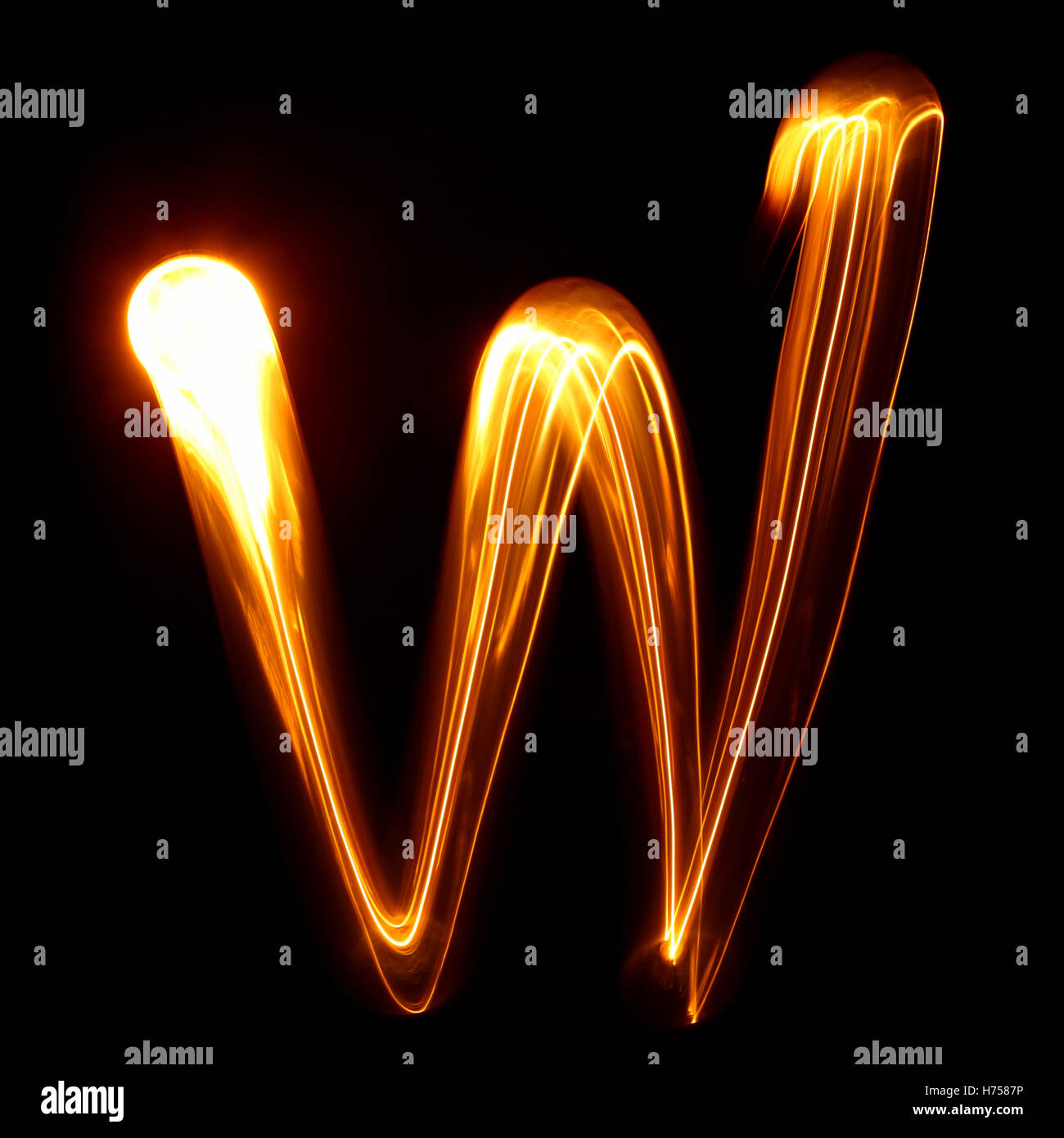 W - Pictured by light letters Stock Photo