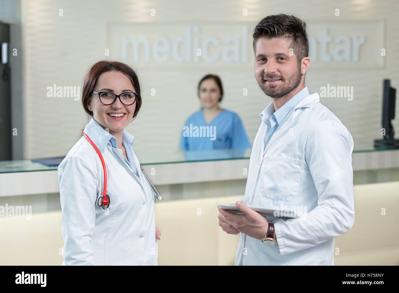 Medical Staff Having Discussion In Modern Hospital Corridor Stock Photo ...