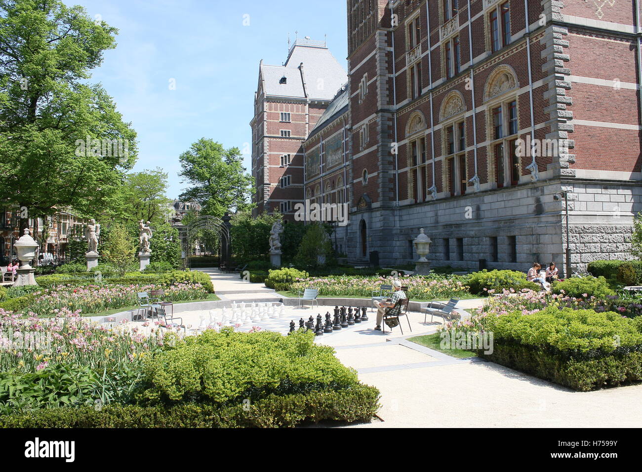 Gardens and western facade of the Rijksmuseum building, Amsterdam, The Netherlands. (Life-size chess game on square) Stock Photo