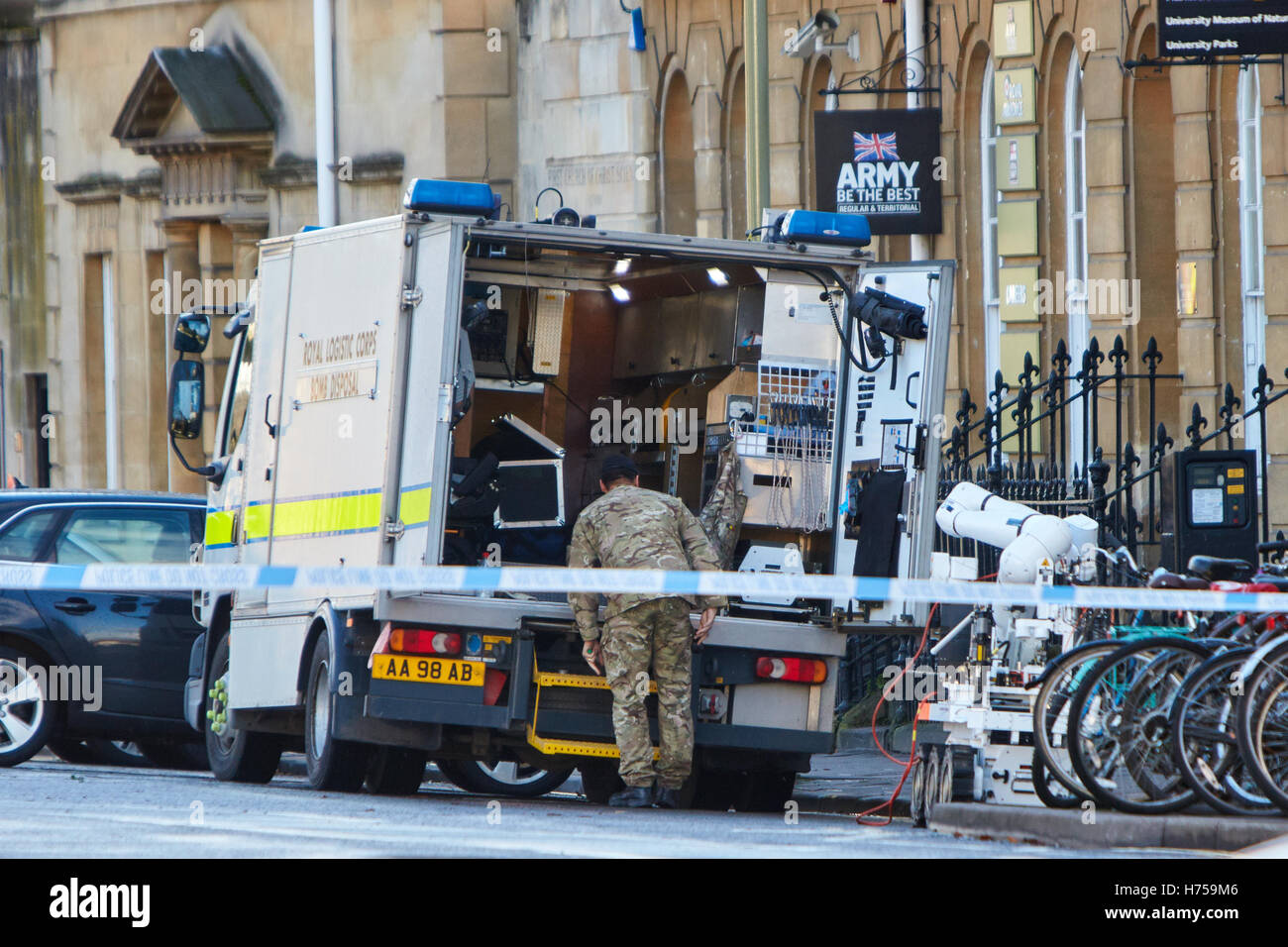 A bomb disposal officer using a remote robot following the discovery of a device at the army recruitment office in Oxford Stock Photo