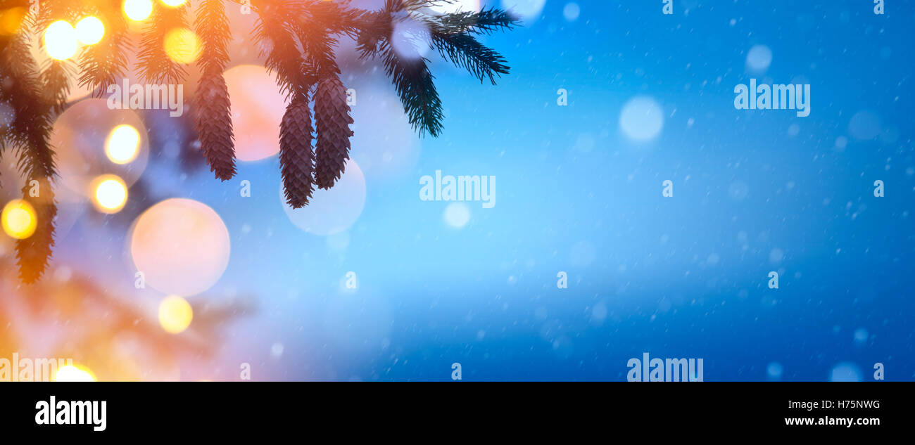 Christmas background with Christmas tree and holidays light Stock Photo
