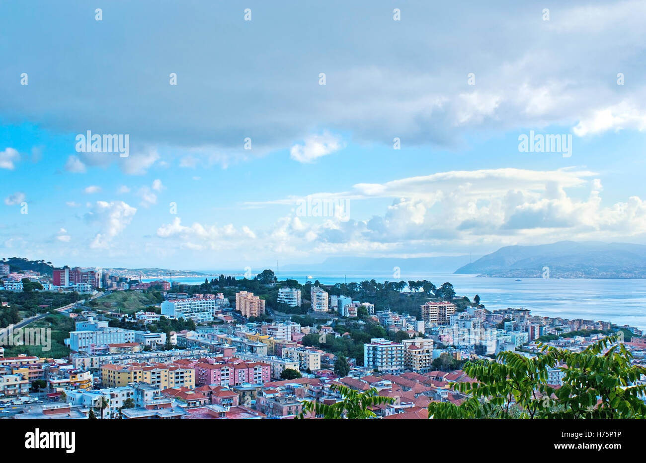 MESSINA, ITALY - OCTOBER 2, 2012: The modern districts of the city with the Messina Strait, separating Sicily from Italian mainl Stock Photo