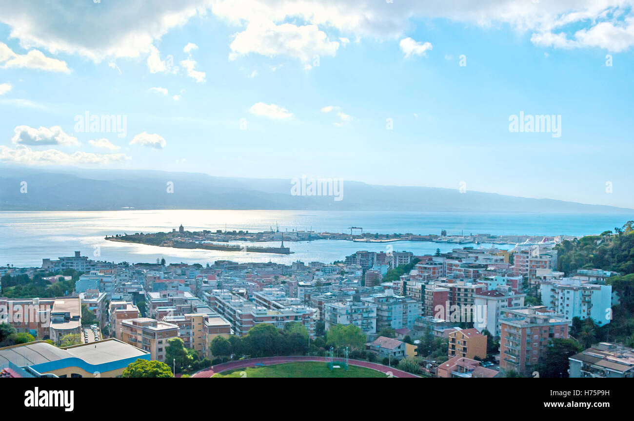 The aerial view of the city, its port, Messina Strait and Reggio Calabria of Italian mainland on other shore Stock Photo