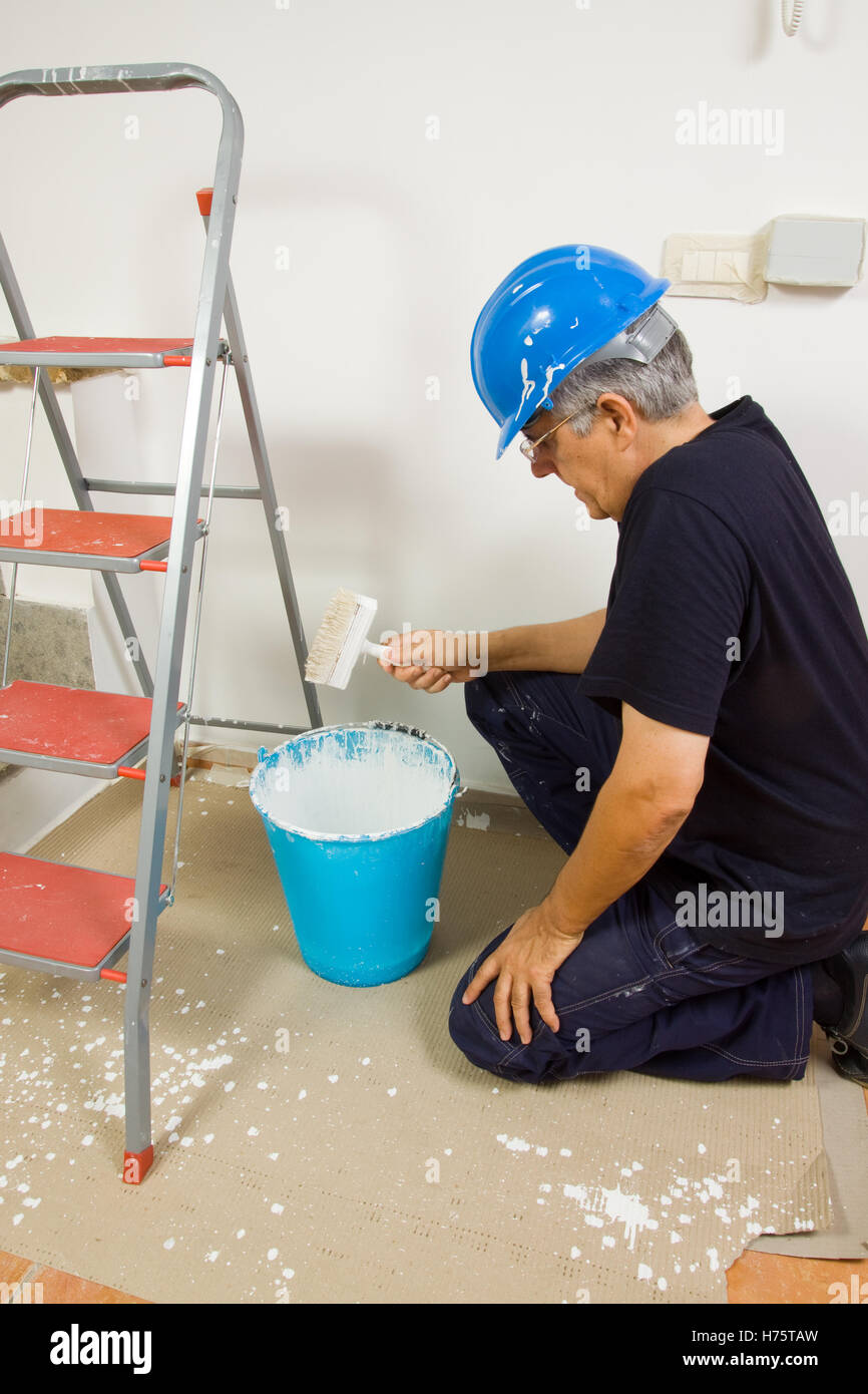 house painter at work in apartment Stock Photo Alamy